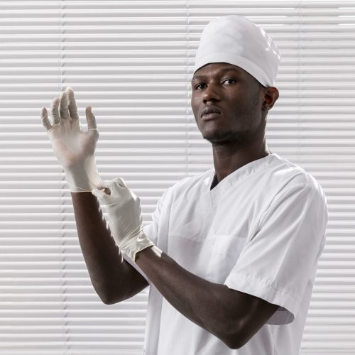 specialist-male-doctor-putting-his-gloves